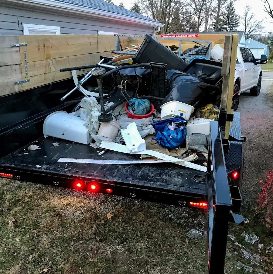 Roll-off dumpster delivered to a residential driveway in Emerald Isle